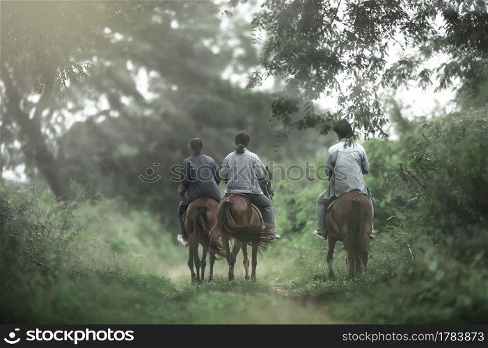 Motion blur. Animal Science studying on horseback. Animal Husbandry at Kasetsart University, K&haeng Saen C&us, Thailand.
