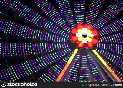 motion blur of a colorful ferris wheel at night