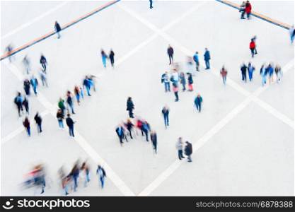 Motion blur of many people. View from above