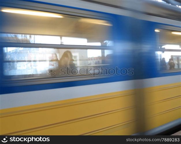 Motion blurred subway train, train station leaving