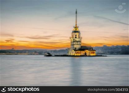 Motion Blurred:Sunset view of Maiden Tower,medieval building,lighthouse,Tower of Leandros over Bosphorus,Turkey. Sunset view of Maiden Tower,medieval over Bosphorus,Turkey