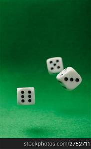 motion dices. Game cubes on a green background