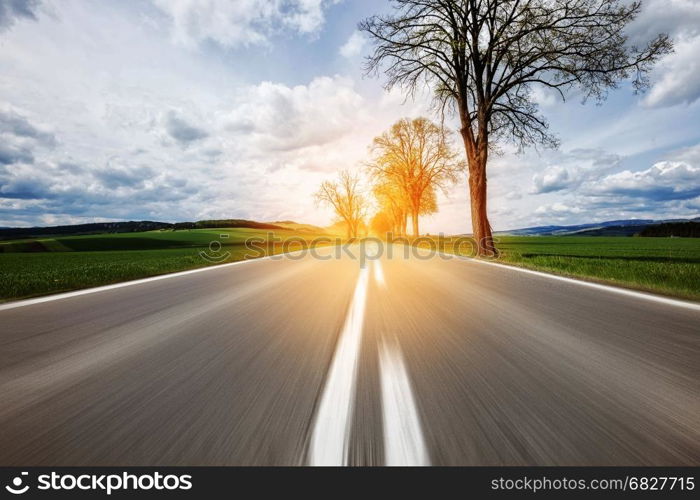 Motion on the asphalt road through the beautiful countryside landscape