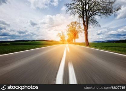 Motion on the asphalt road through the beautiful countryside landscape