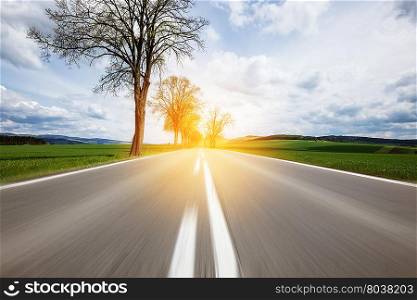 Motion on the asphalt road through the beautiful countryside landscape