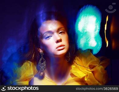 Motion. Stylized Woman in Radiant Abstract Lights. Illusion