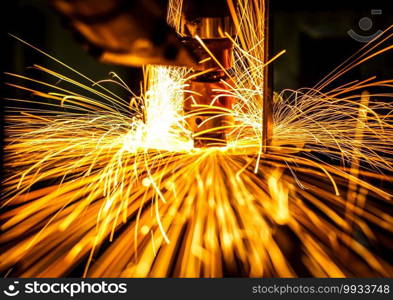 Motion Welding robots in a car factory with sparks, manufacturing, industry, factory