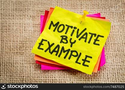 motivate by example - advice or reminder on a yellow sticky note