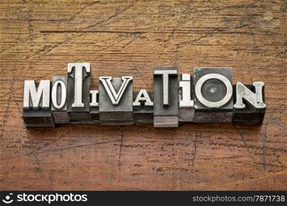 motivation word in mixed vintage metal type printing blocks over grunge wood