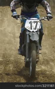 Motocross rider riding a motorcycle
