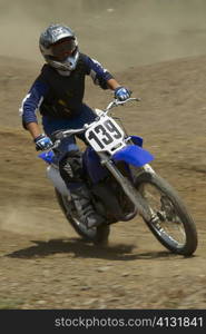 Motocross rider riding a motorcycle