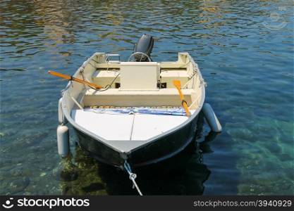 Motor boat anchored in the small port on Elba Island, Italy.