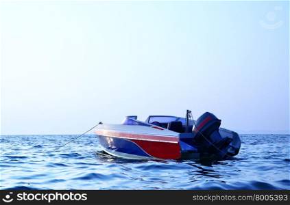 Motor boat and sea at sunrise