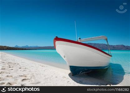 Motor boat at the paradise beach with white sand, turquoise sea and blue sky, Playa Isla Coronado, Mexico