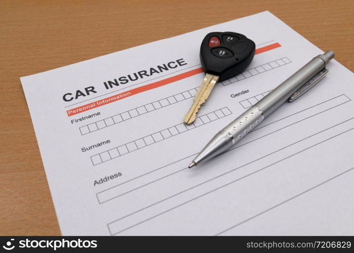 motor insurance with car key and pen