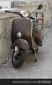 Motor scooter near a wall, Italian Riviera, Santa Margherita Ligure, Genoa, Liguria, Italy