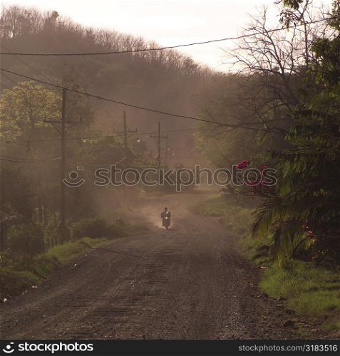 Motorcycle on dusty road in Costa Rica