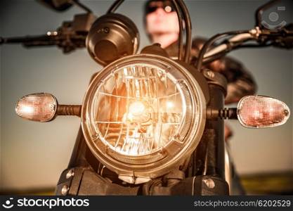 Motorcycle on the road motorcycle headlamp closeup