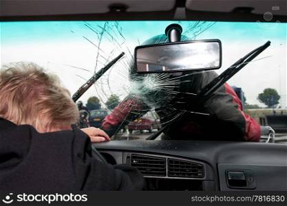 Motorist smashes the windscreen of a car with his helmet after a frontal collision with a car