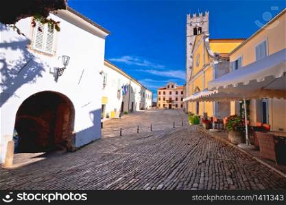 Motovun. Main stone square and church in historic town of Motovun, Istria region of Croatia
