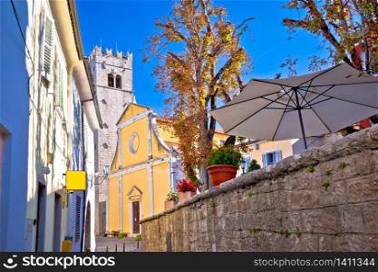 Motovun. Old cobbled street and church in historic town of Motovun, Istria region of Croatia