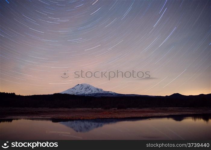 Mount Adams makes a perfect reflection as the Stars register as lines in a long exposure