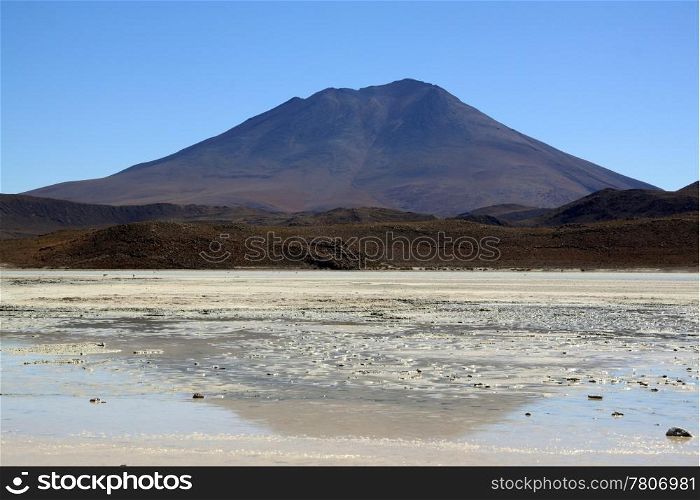Mount and salt lake near Uyuni in Bolivia