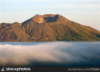 Mount Batur in the clouds at sunrise on Bali Indonesia
