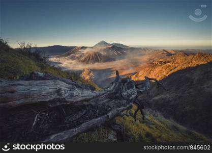 Mount Bromo at sunrise. An active volcano, one of the most visited tourist attractions in east Java from viewpoint, Indonesia. Natural landscape background.