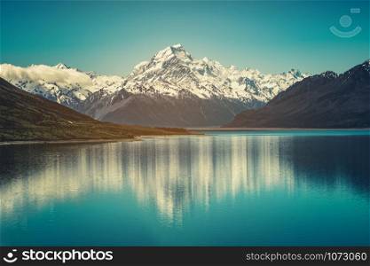 Mount Cook landscape reflection on Lake Pukaki, the highest mountain in New Zealand and popular travel destination. The mountain is in Aoraki Mount Cook National Park in South Island of New Zealand.