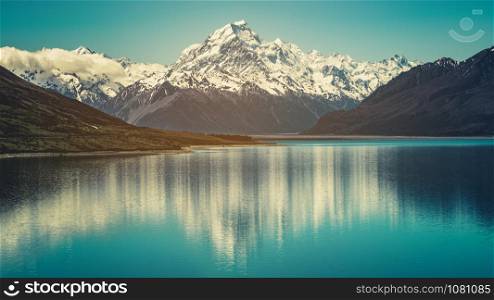 Mount Cook landscape reflection on Lake Pukaki, the highest mountain in New Zealand and popular travel destination. The mountain is in Aoraki Mount Cook National Park in South Island of New Zealand.