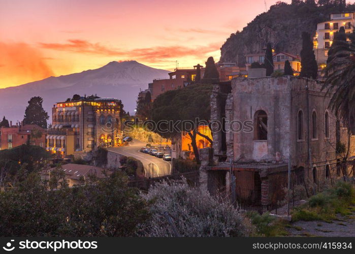 Mount Etna volcano at sunset, as seen from Taormina, Sicily. Mount Etna at sunrise, Sicily, Italy