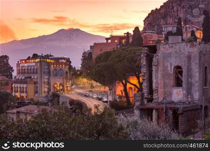 Mount Etna volcano at sunset, as seen from Taormina, Sicily. Mount Etna at sunrise, Sicily, Italy