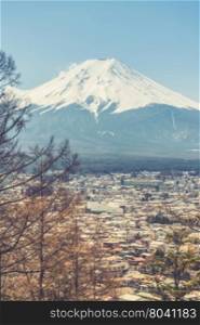 Mount Fuji view from Red pagoda in japan (Vintage filter effect used)
