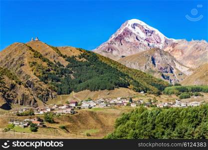 Mount Kazbek and Stepantsminda town in Georgia. It is a one of the major mountains of the Caucasus.