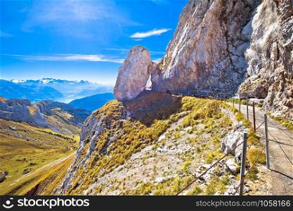 Mount Pilatus cliffs walkway with alpine peaks view, mountain landscapes of Switzerland