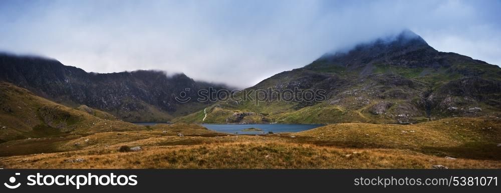 Mount Snowdon covered in low hanging cloud over Llyn Llydaw in Snowdonia National Park