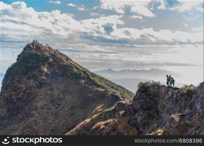 Mount Tanigawa, Gunma Prefecture,Niigata,Japan - October 26, 2014: &#xA;Men and woman with Trekking backpacks are walking on trail to the &#xA;top of Mount Tanigawa.