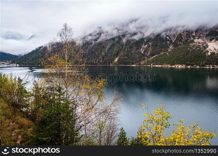 Mountain alpine autumn lake Achensee, Alps, Tirol, Austria. Picturesque traveling, seasonal and nature beauty concept scene.