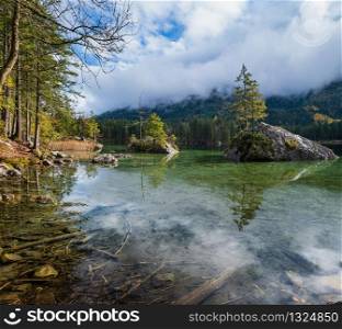 Mountain alpine autumn lake Hintersee, Berchtesgaden national park, Deutschland, Alps, Bavaria, Germany. Picturesque traveling, seasonal and nature beauty concept scene.