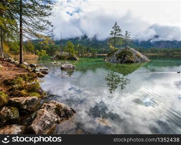 Mountain alpine autumn lake Hintersee, Berchtesgaden national park, Deutschland, Alps, Bavaria, Germany. Picturesque traveling, seasonal and nature beauty concept scene.