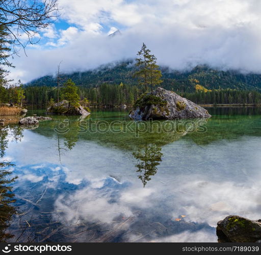 Mountain alpine autumn lake Hintersee, Berchtesgaden national park, Deutschland, Alps, Bavaria, Germany. Picturesque traveling, seasonal and nature beauty concept scene.