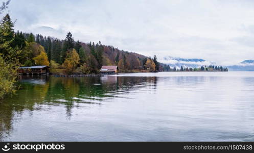 Mountain alpine autumn overcast evening lake Walchensee view, Kochel, Bavaria, Germany. Picturesque traveling, seasonal and nature beauty concept scene.