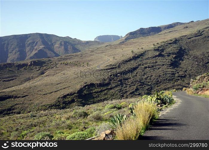Mountain and asphalt road on the La Romera island, Spain