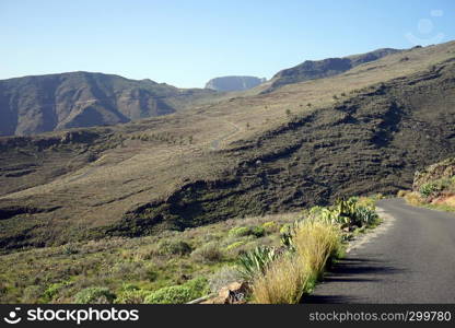 Mountain and asphalt road on the La Romera island, Spain