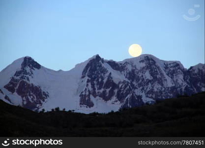 Mountain and fool moon mear El Chalten in Paragonia, Argentina