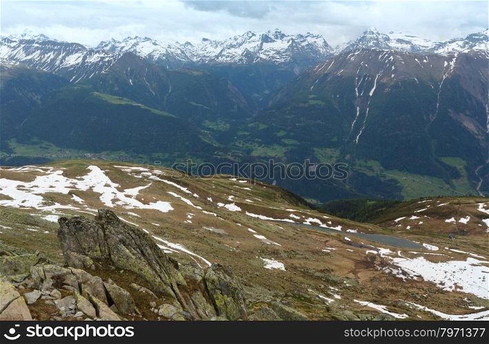 Mountain Bettmeralp (Switzerland) summer top view with small lake.