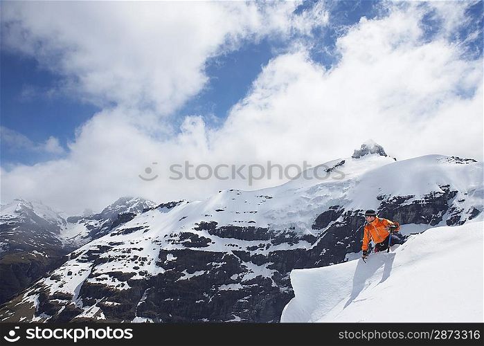 Mountain climber reaching peak