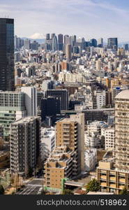 Mountain Fuji with Tokyo skylines and skyscrapers buildings in Shinjuku ward in Tokyo. Taken from Tokyo Bunkyo civic center observatory sky desk.