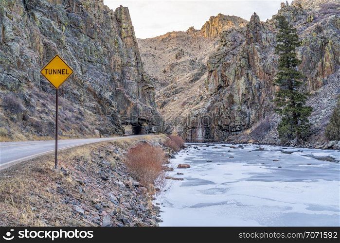 mountain highway with a tunnel - Poudre River canyon in Rocky Mountains in northern Colorado, winter scenery